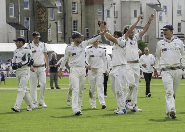 Yorkshire's players celebrate their victory over Nottinghamshire at Scarborough.