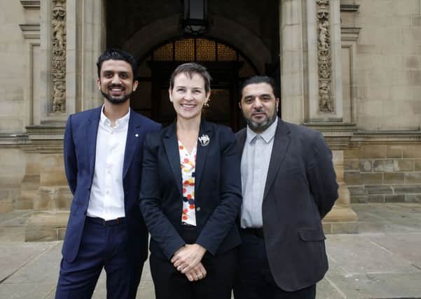 Mary Creagh and Penny Appeal's Adeem Younis and Aamer Naeem.