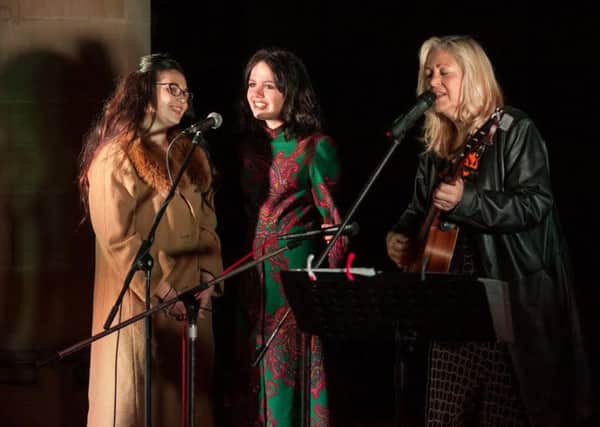 The Voice 2014  finalist Sally Barker, playing the guitar in Ossett with fellow contestants Sophie May Williams and Georgia Harrup. Picture: Eternity photo