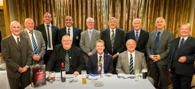 On the front row, from left to right, are Malcolm Lord (MC), Rotary President Chris Sharp, and Big Jim Mills. On the back row, left to right. are Ken Rollin, Brian Lockwood, Nick Fozzard, Paul Mallinder, Ian Brooke, Neil Fox, Terry Crook, Bob Haigh and Joe Bonnar.