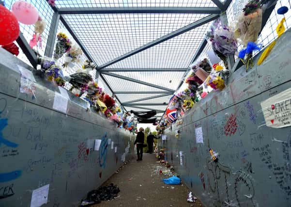 Tributes left for 12 years old Spencer Walker fill the railway foot bridge off Beamont Avenue, South Elmsall. (AB352a1016)