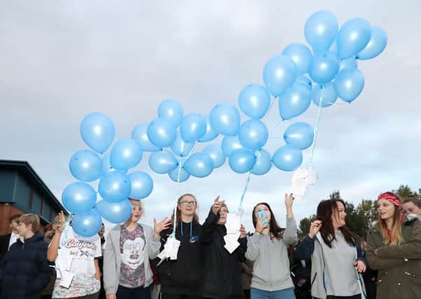 Minsthorpe School releasing tribute balloons and messages in memory of Spencer Walker.