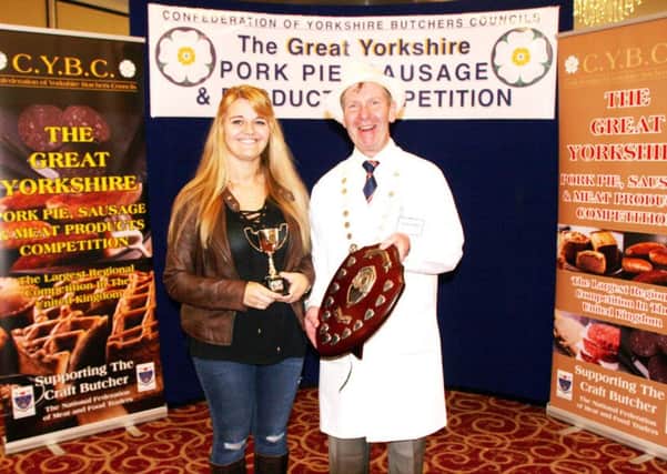 Emily Hofmann, of H Hofmann and Sons Butchers, is pictured receiving the thin pork sausage trophy from CYBC president Konrad Kempka.