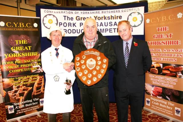 Mike Wormald, centre from Rhubarb Triangle Farm Shop, is pictured receiving the Great Yorkshire beef burger trophy from CYBC president Konrad Kempka, left, and Steve Sefton, technical sales manager of sponsors W R Wright & Sons.