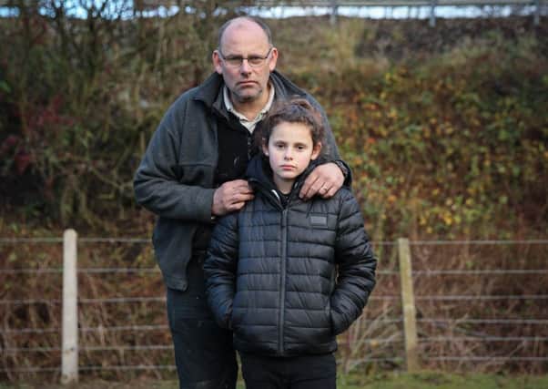 Samantha Ashby, 11, with dad Darryl.  Picture: Ross Parry Agency