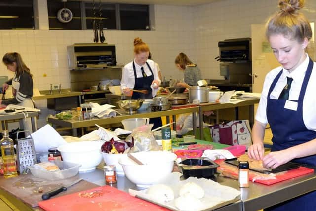 Kitchen gurus: Sophie Tolson, of Silcoates School, right, concentrates on her culinary tasks along with the other contestants at Wakefield College.