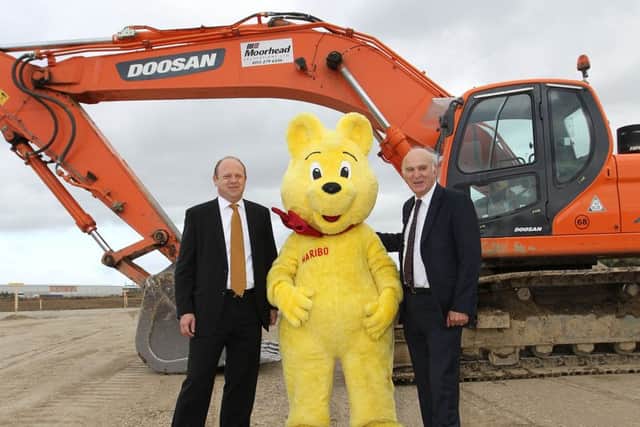 Herwig with Vince Cable at the factory site in 2013.