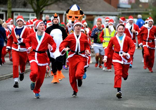 The annual Santa Dash in aid of Pontefract's Prince of Wales hospice.
Picture ref: AB368b1216