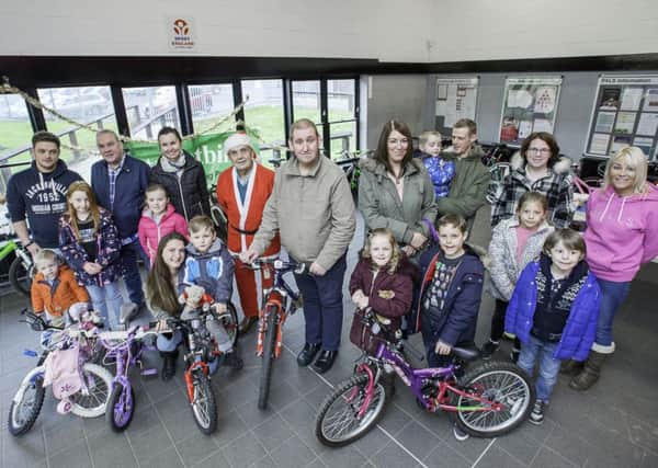 Streetbikes does a Christmas giveaway every year, offering fixed-up cycles to families short of cash.