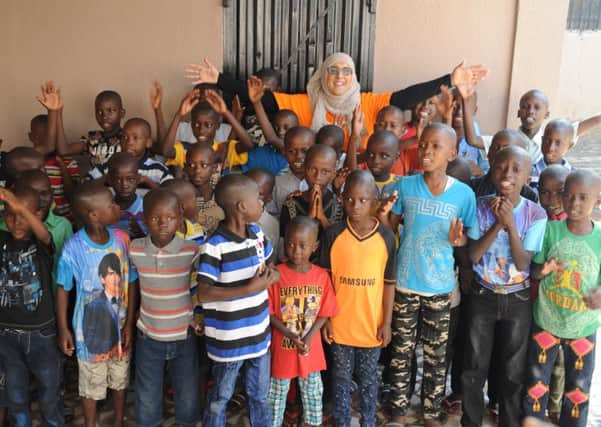 HELPING HAND: Ridwana Wallace-Laher, from the Penny Appeal, met with orphans during her fact-finding trip to The  Gambia.