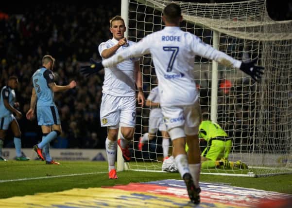Chris Wood celebrates his second goal against Rotherham and shares his delight with Kemar Roofe, who supplied the cross. Picture: Bruce Rollinson