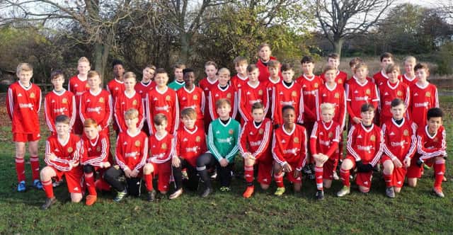 Ossett Town Juniors with their new kits, donated by company Unita.