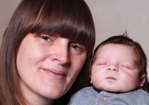 Baby Harrison Wright was first to be born on New Year's Day at Dewsbury Bronte birth centre. pictured with mum Gemma