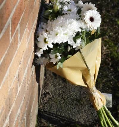 Floral tributes on Lingwell Nook Ln, Lofthouse