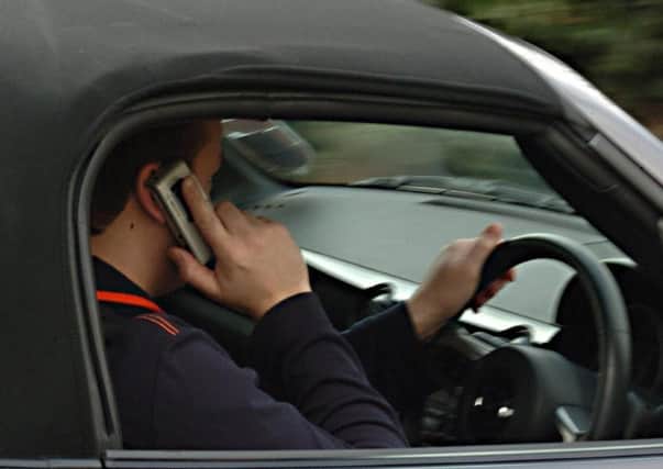 Police are cracking down on mobile use behind the wheel