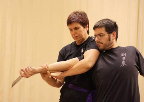 Bev Stack practices her technique at the Lau Gar Kung Fu club.