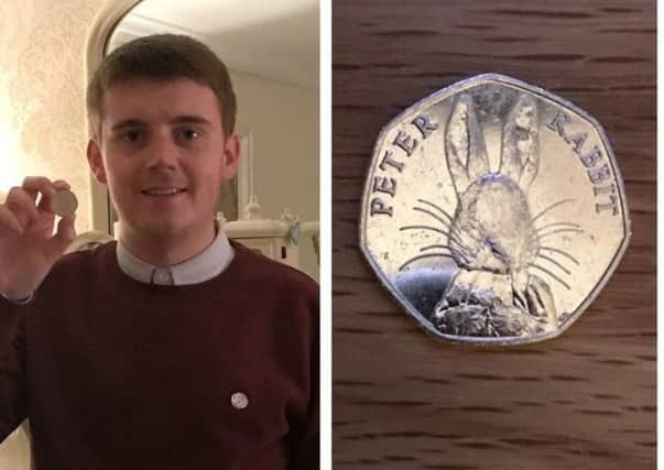 CaolÃ¡n McGinley, pictured with the coin he found.