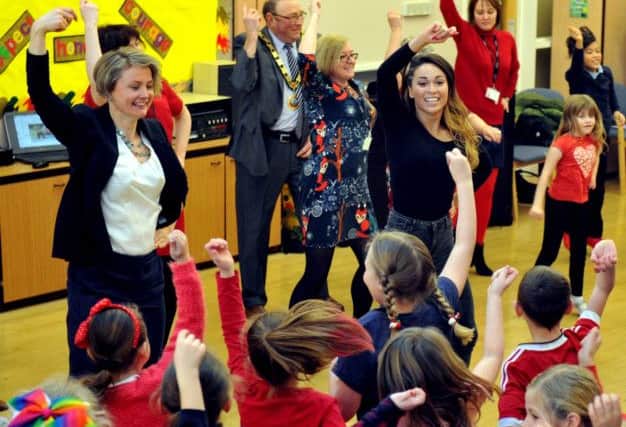 030217   Local MP Yvette Cooper performing the  Gagnam Style dance with her husband  Ed Balls  Strictly Come Dancing Partner Katya Jones with pupils at Normanton Common Junior School in Normanton.
