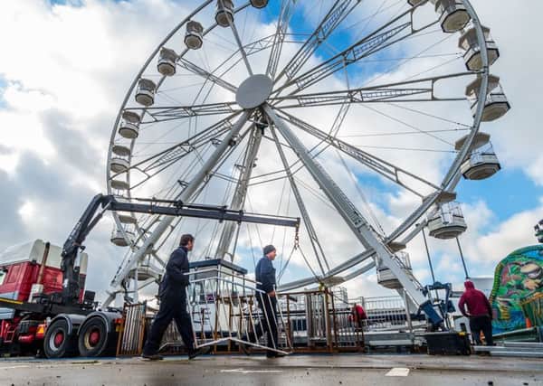 Preparation work for this year's Leeds Valentines Fair, held just behind Elland Road, Leeds. Pictured Reece Robinson, and John Noyce, working on the Giant Wheel. Picture: James Hardisty