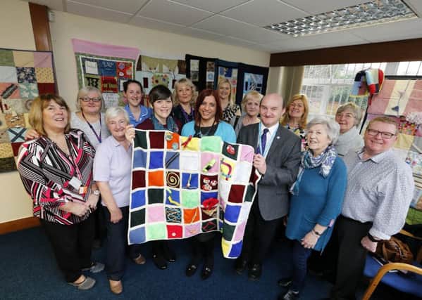 launch: The unveiling of the quilts , which are designed to stir memories and stimulate feelings.