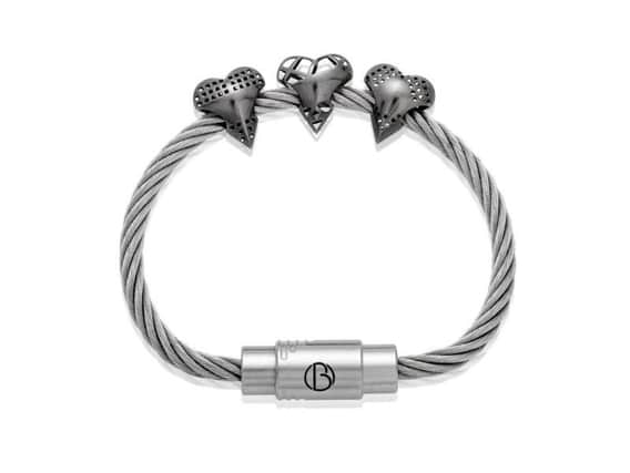 The three stainless steel heart-shaped 3D printed bead designs on a CABLE bracelet.