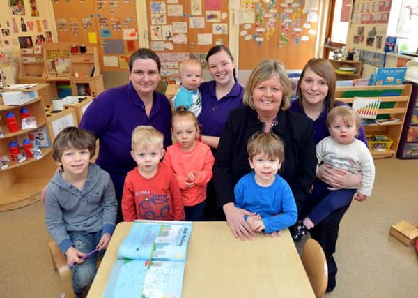 Manager Jill Craig with staff members and children, who are looking forward to the extension.