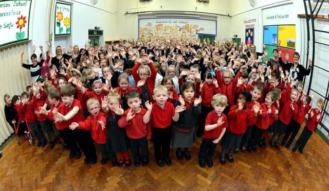 Staff and pupils at Netherton J&I are all smiles after being ranked as good by inspectors.