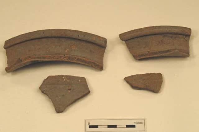 excavated: Shards of Roman pottery.