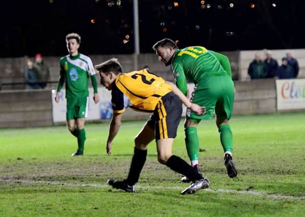Mike Fish beats Ossett Albion's Oliver Yates to score Brighouse Town's first goal
