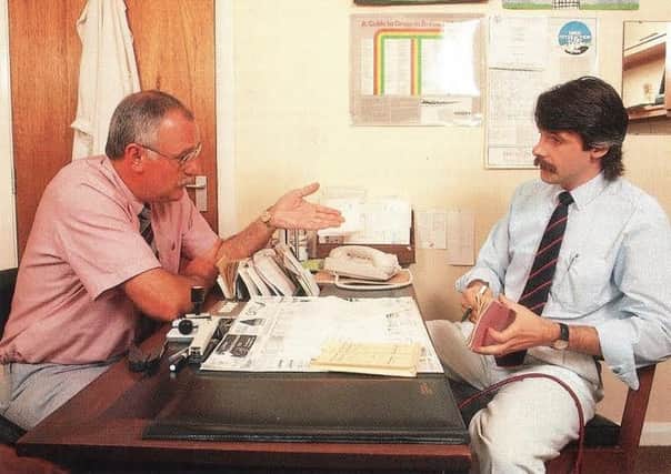 TALK: Dr Geoff Slater, left, and fellow Southgate Surgery partner Stephen Wroe discussing work in 1991.