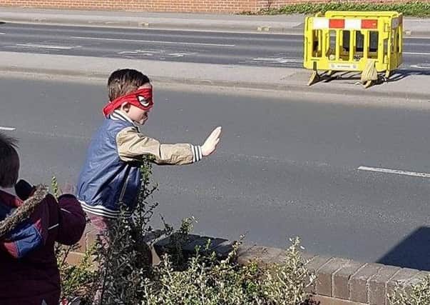 Six-year-old superhero Leon entertained passers-by in his Spiderman mask.