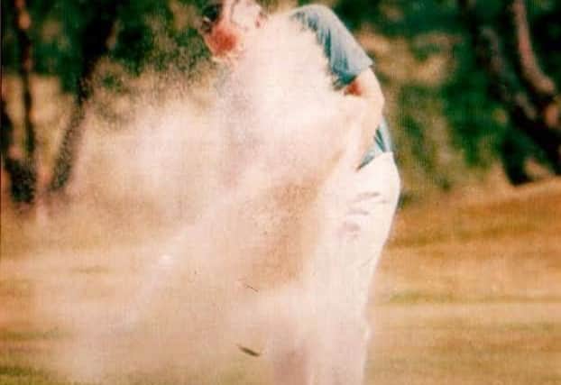 KEEN GOLFER: Dr Geoff Slater blasting out of a bunker in 1991
