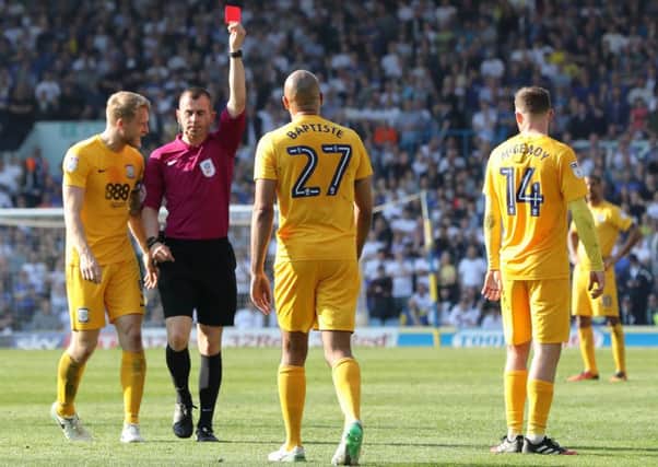 Preston's Alex Baptiste is red carded after kicking out at Leeds United's Pablo Hernandez. Picture: Bruce Rollinson