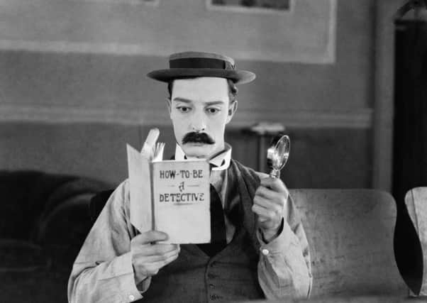 1924: American comedian Buster Keaton (1895-1966) armed with only a magnifying glass and a copy of 'How To Be A Detective' hopes to become a great detective in the film 'Sherlock Junior'.