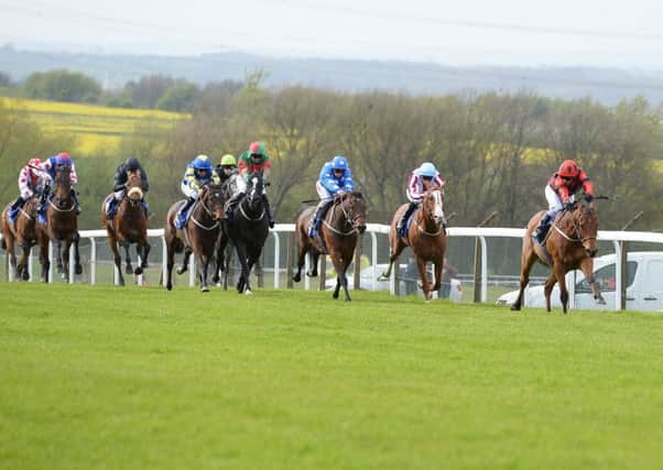 Action from Pontefract's opening meeting of the season when Snoano (right), ridden by David Allan, won the feature race on the card. Picture: Alan Wright.