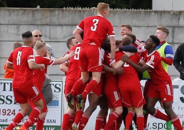 Ossett Town players celebrate reaching the play-offs. Pic: Mark Gledhill