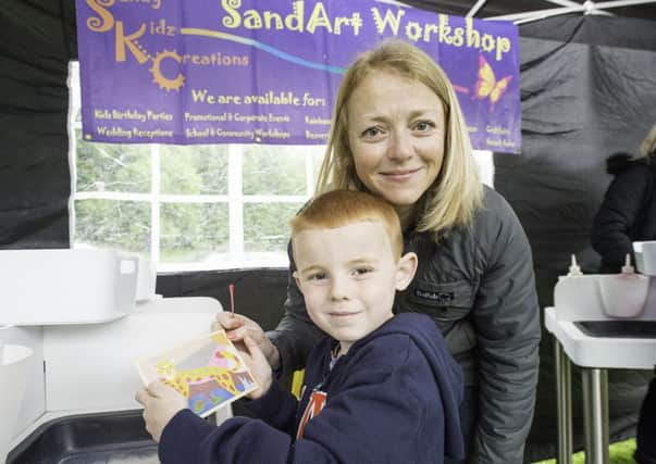 Picture by Allan McKenzie/YWNG - 01/05/17 - Press - Thornes Park May Day Gala, Wakefield, England - Alison Hoyle with son Tobias at the Sand Art workshop.