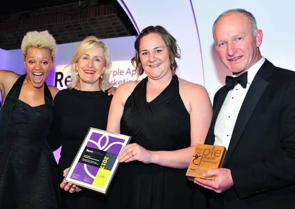 AWARD: Radio 1s Gemma Cairney, left, awards host Deborah Owen-Ellis Clark and the Trinity Walk team.