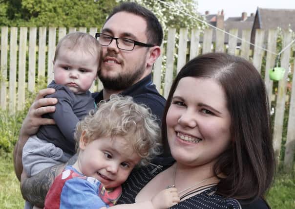 Charlotte Kenny and Adam Evans are trying to raise Â£5,000 to adapt their garden for their poorly and disabled son Logan. Pictured with Logan's younger brother Tobi.