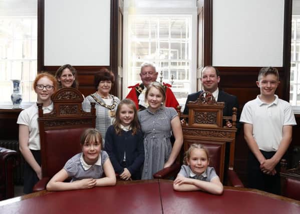 Children from Stanley Grove School visiting Wakefield Town Hall to talk to the mayor and councillors about balloon and lantern releases and their effect on the environment.