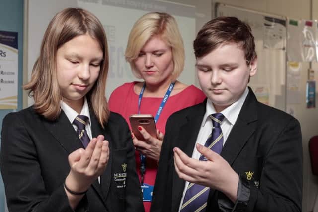 Minsthorpe community college students starting project involving living without their phones.
Hannah and Athan with Helena Fallon