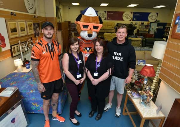 Newspaper: Pontefract & Castleford Express.
Story: Castleford Tigers players visited Prince of Wales Hospice furniture shop in Castleford town centre.
They will be volunteering to work there as part of volunteers week.
Pictured L to R) Zak Hardaker, Diane Peters - Comms & Marketing (hospice), Sarah Lowden - hospice shop manager, Adam Milner.
Reporter: Nick Frame.
Photographer: Andrew Bellis
email: andrewbellisphotography@gmail.com
Twitter: @SnapperAndrewB
Mobile: 07885 426 523
Photo date: 18/05/17
Picture ref: AB141a0517