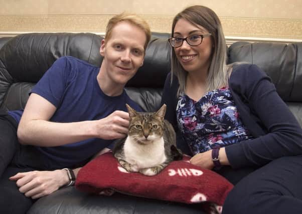 OUR HERO: Missy who is up for Most Caring Cat with owners Craig and Rosie Jones, of Horbury. Picture: Cats Protection/PA Wire