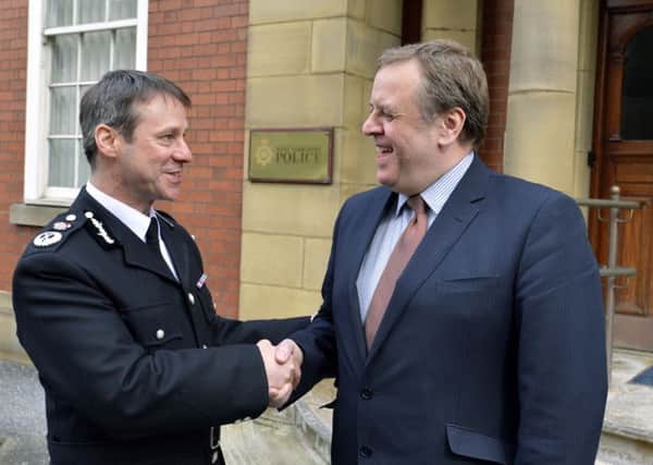 WAR OF WORDS: Mark Gilmore is pictured with West Yorkshire PCC, Mark Burns-Williamson, on his first day in charge in 2013. Picture: Mike Cowling, April 2 2013