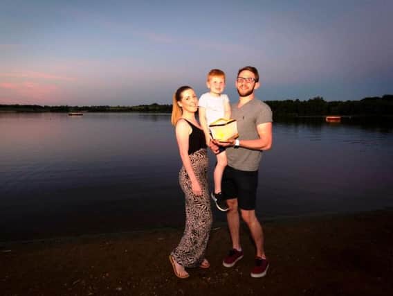 FITTING TRIBUTE: Amanda Parkinson, fianc Luke Newton and his son Alfie at Lights on the Lake.