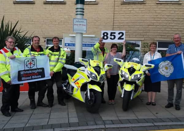 Beverly Clark, the mother of Lewis Clark, who was tragically killed in a motorcycle accident, has been reunited with a Blood Bike bearing his name on the week of his birthday. She was joined by volunteers and hospital staff at Calderdale Royal Infirmary.