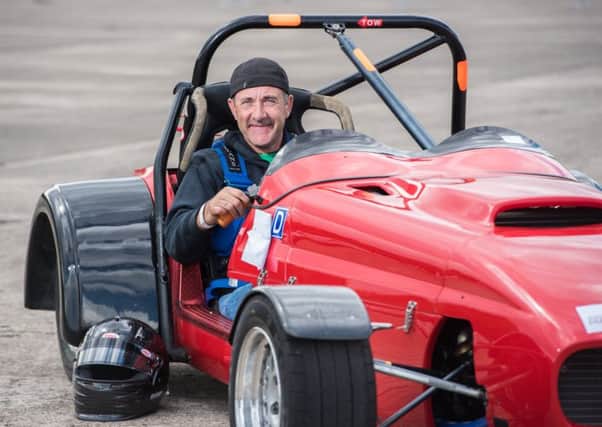 LABOUR OF LOVE: Chris Meister behind the wheel of his Phoenix. Picture by SWNS.