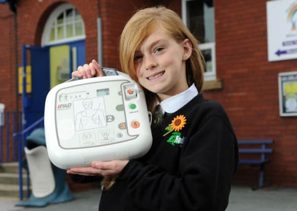 Cody Hartley has donated a defib to her former primary school,  Thorpe Primary School,  to help save lives, and has started a  campaign to get one in every school and public place as part of our first aid campaign.  18 October 2013.  Picture Bruce Rollinson