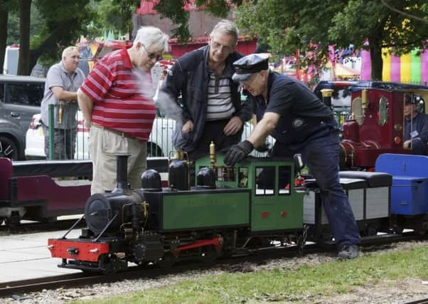 ALL ABOARD: Enthusiasts inspect the locomotive at  a an open day at the miniature railway in Thornes Park. All pictures by Walt Covell, of Ossett Camera Club.