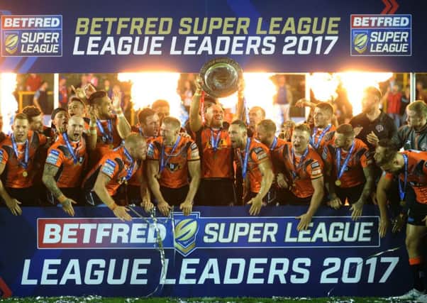 TIGERS' FEAT: Castleford Tigers celebrate after beating Wakefield and securing top spot in the top flight for the first time in the club's 91-year senior history. PIC: Jonathan Gawthorpe
